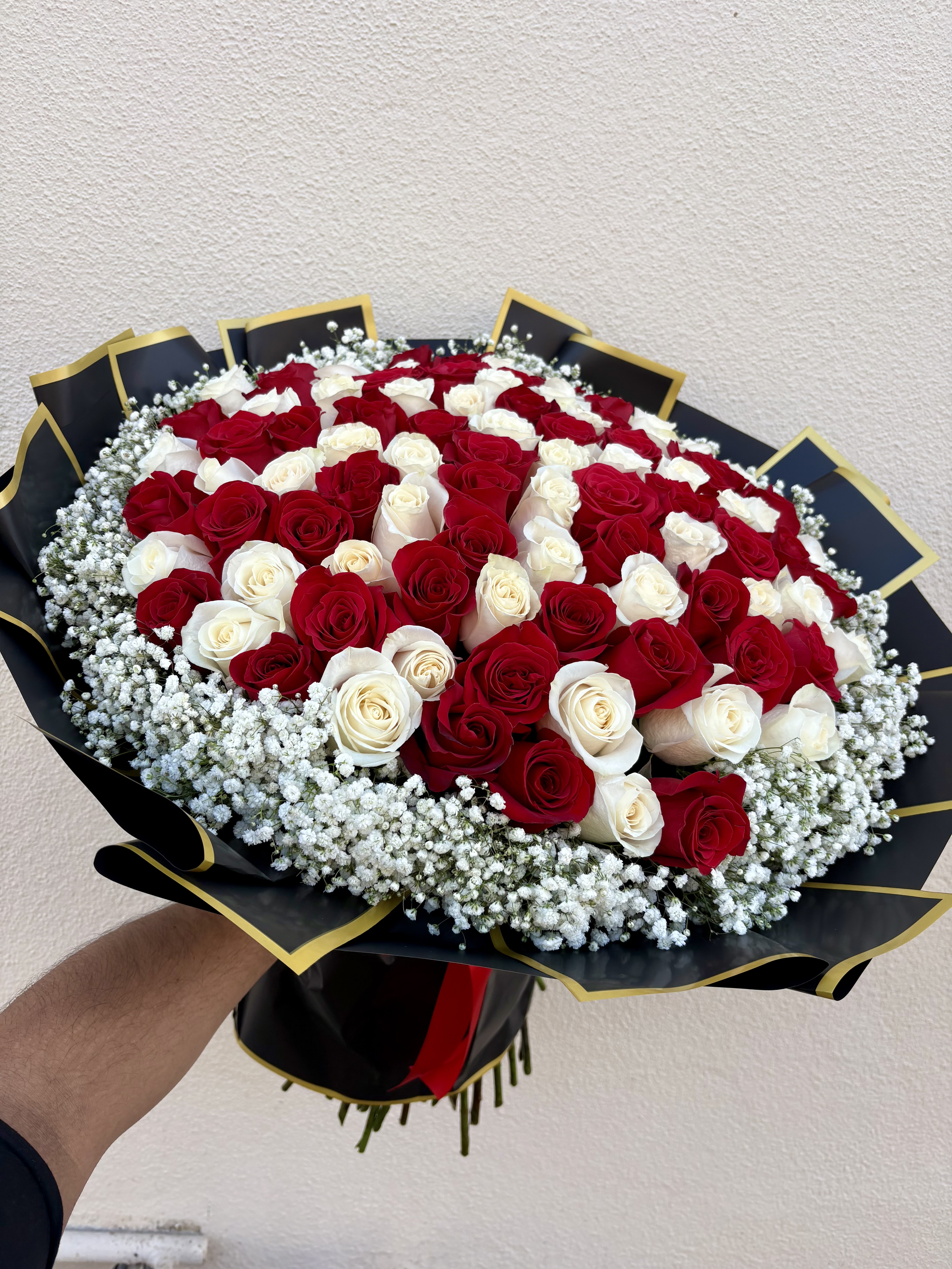 100 Red And White Roses 🥀 – 100 Red and White Long Stem Roses With Gypsophila Around Wrapped In Black And Gold Trim Korean Paper ♥️